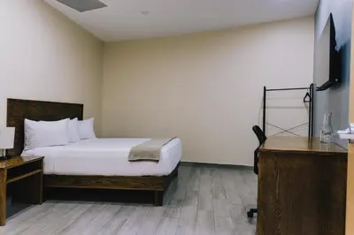 Cama o camas de una habitación en Hospedaje Consular by Dunas