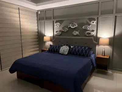 Cama o camas de una habitación en Sunset View Condo