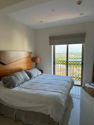 Cama o camas de una habitación en Las Gavias frente al mar