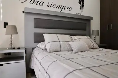 Cama o camas de una habitación en Dpto de 2 recamaras con alberca