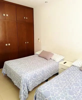 Cama o camas de una habitación en Departamento Flamingo del Lago - 1 Min Malecón