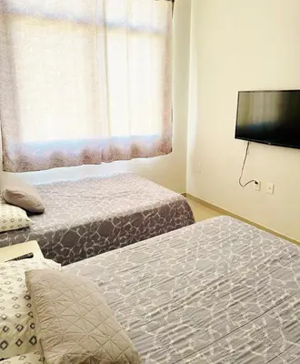 Cama o camas de una habitación en Departamento Flamingo del Lago - 1 Min Malecón