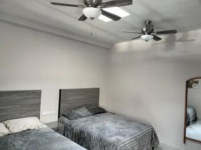 Cama o camas de una habitación en Executive Apartment