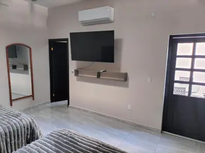 Cama o camas de una habitación en Executive Apartment
