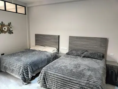 Cama o camas de una habitación en Executive Apartment