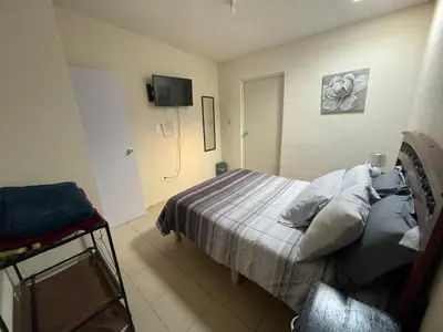 Cama o camas de una habitación en Casa Huésped a 5 minutos del Aeropuerto