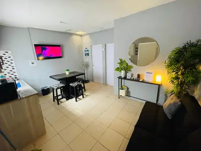 Una televisión o centro de entretenimiento en Casa Huésped a 5 minutos del Aeropuerto