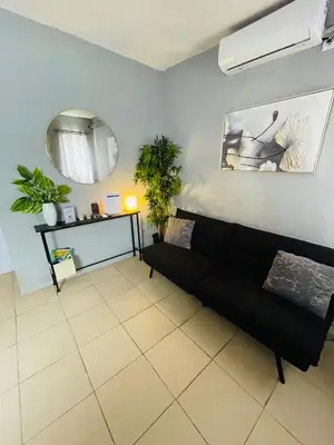 Zona de estar de Casa Huésped a 5 minutos del Aeropuerto