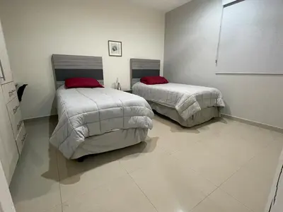 Cama o camas de una habitación en Apartamento en PB con piscina a poca distancia de la playa