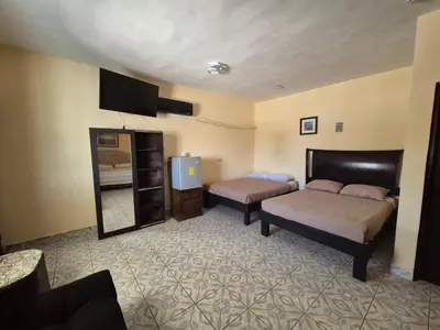 Cama o camas de una habitación en Hotel Destination Cuatro Cienegas