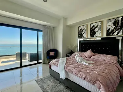 Cama o camas de una habitación en Sunset Malecón View