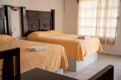 Cama o camas de una habitación en Hotel Pueblo Viejo