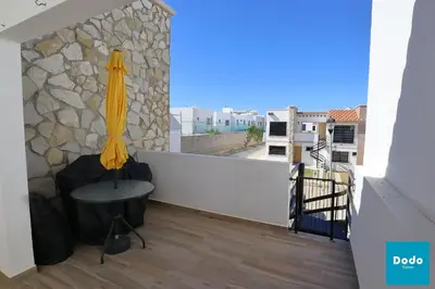 Un balcón o terraza de Residencial privado con alberca