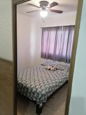 Cama o camas de una habitación en Torre Romo Departamento 1-2