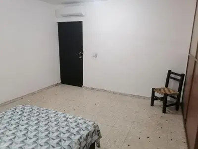 Cama o camas de una habitación en Torre Romo Departamento 1-2