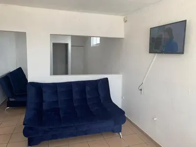 Una televisión o centro de entretenimiento en Torre Romo Departamento 5