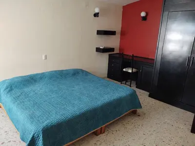 Cama o camas de una habitación en Casa Grande Céntrico cerca del Malecón