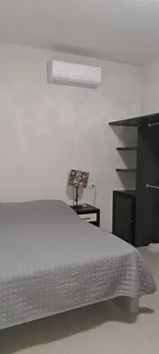 Cama o camas de una habitación en Tres Palmas Departamentos