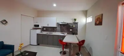 Una cocina o zona de cocina en Tres Palmas Departamentos