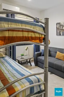 Cama o camas de una habitación en Torre con roof garden y piscina vista al mar