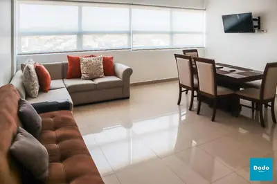 Una televisión o centro de entretenimiento en Departamento en Torre M