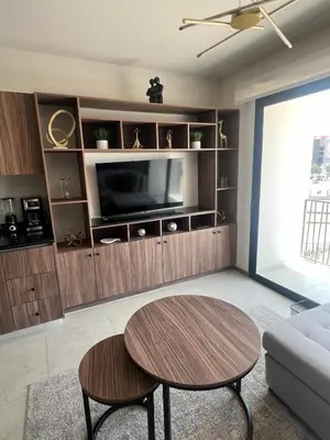 Una televisión o centro de entretenimiento en Modern and equipped apartment