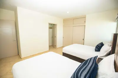 Cama o camas de una habitación en Elegant Condo at Playa Brujas with Ocean View