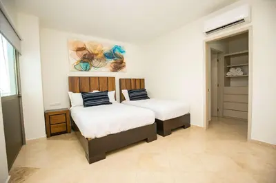Cama o camas de una habitación en Elegant Condo at Playa Brujas with Ocean View