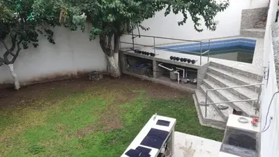 Jardín al aire libre en Casa con Alberca cerca del Aeropuerto
