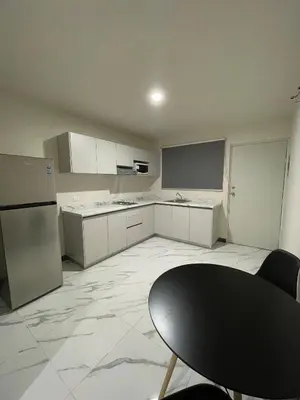 Una cocina o zona de cocina en Suites 115
