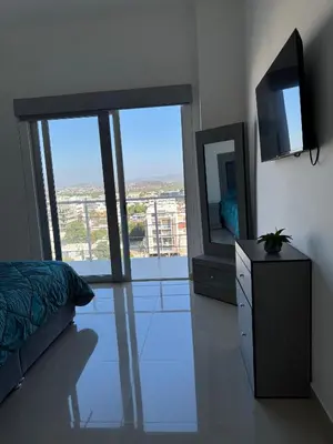 Una televisión o centro de entretenimiento en Faava Departamentos