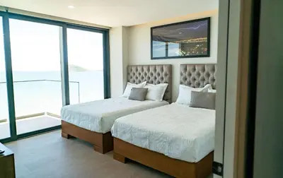 Cama o camas de una habitación en Apartment on the Malecon 2 BR Ocean View