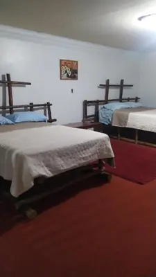 Cama o camas de una habitación en Hotel Rincón Paraíso