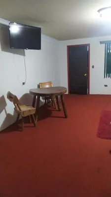 Una televisión o centro de entretenimiento en Hotel Rincón Paraíso