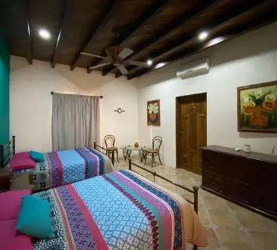 Cama o camas de una habitación en Hacienda Magdalena
