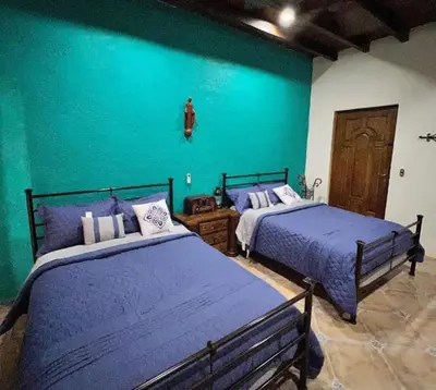 Cama o camas de una habitación en Hacienda Magdalena