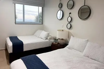 Cama o camas de una habitación en Condo Playa & Waterfront Heated Alberca
