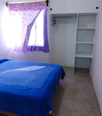 Cama o camas de una habitación en Bienvenidos a la casa gris