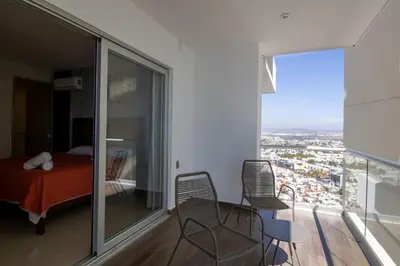 Cama o camas de una habitación en Elegante con vista al mar y balcón by G P S rentas