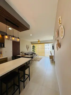 Zona de estar de Almarena Depto Boho Chic 800 mts from the Beach!
