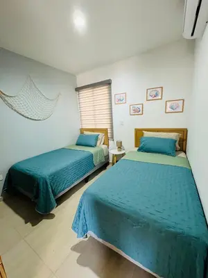 Cama o camas de una habitación en Almarena Depto Boho Chic 800 mts from the Beach!