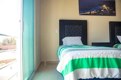 Cama o camas de una habitación en House in Punta Cerritos 3 Bedrooms and Rooftop