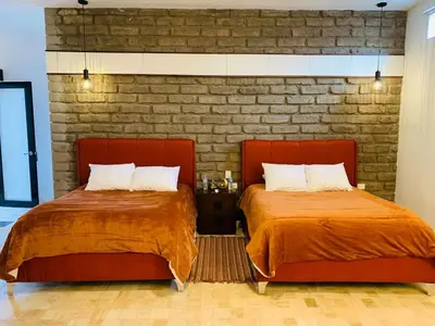 Cama o camas de una habitación en Hotel Boutique El Embrujo Mágico