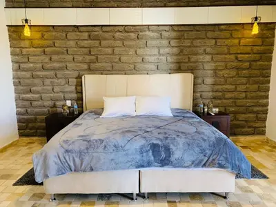 Cama o camas de una habitación en Hotel Boutique El Embrujo Divino