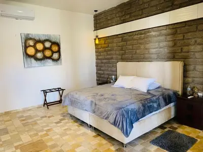 Cama o camas de una habitación en Hotel Boutique El Embrujo Divino