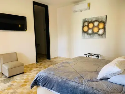 Cama o camas de una habitación en Hotel Boutique El Embrujo Divino