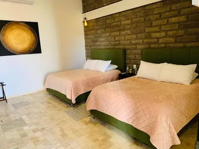 Cama o camas de una habitación en Hotel Boutique Embrujo Luna