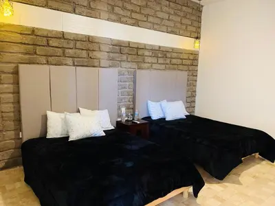 Cama o camas de una habitación en Hotel Boutique Embrujo Murmullo