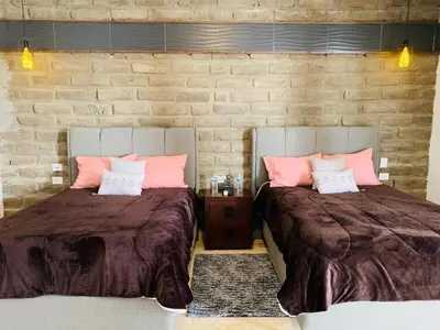 Cama o camas de una habitación en Hotel Boutique Embrujo Intuición