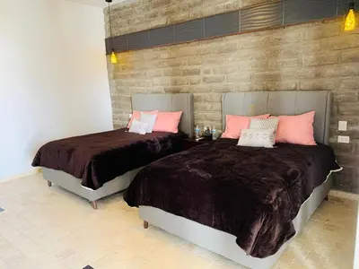Cama o camas de una habitación en Hotel Boutique Embrujo Intuición